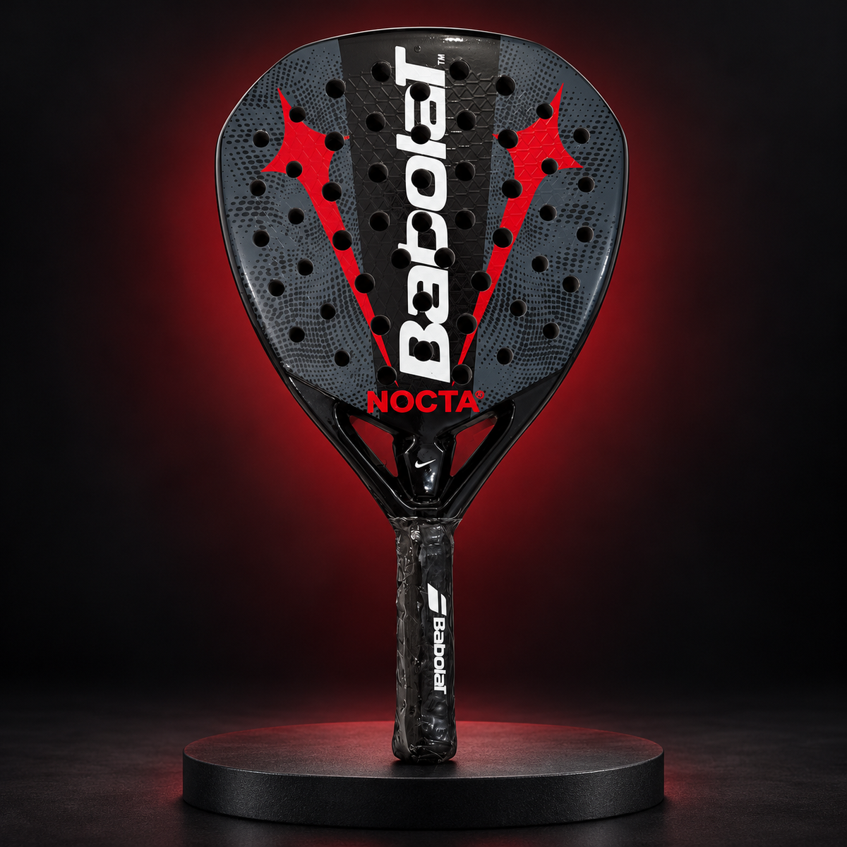 Babolat Nocta racket in a dark red studio