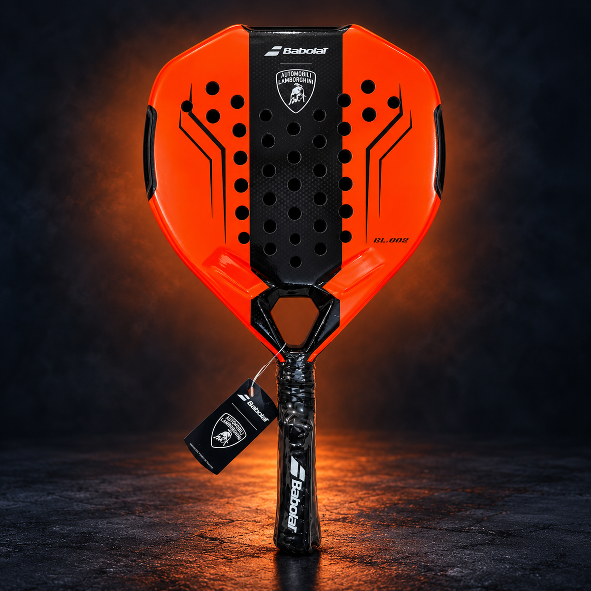 Orange Lamborghini-style padel racket on dark studio background