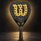 Wilson Defy Pro racket on dark gold studio background